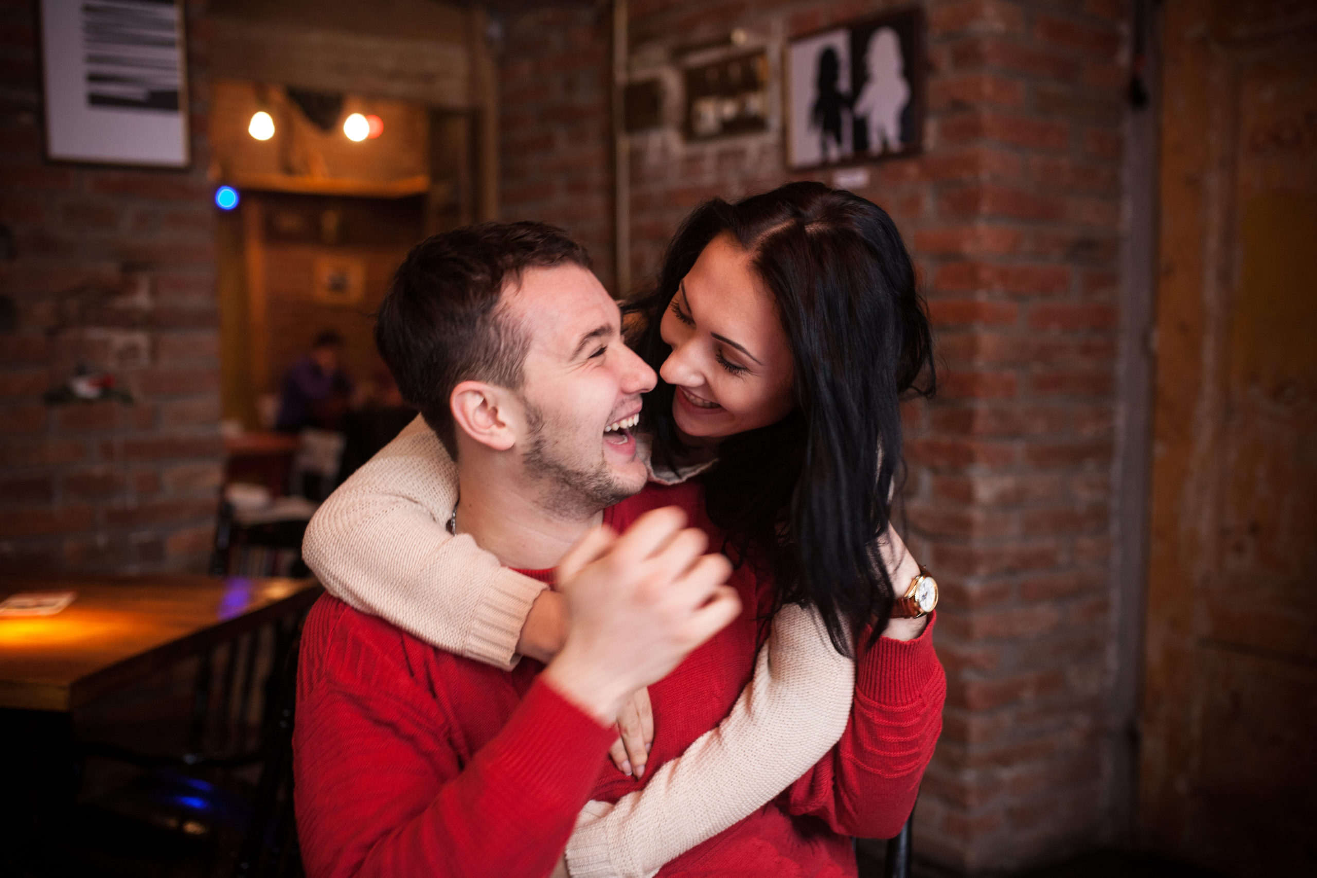 charming-couple-embracing-laughing-loud